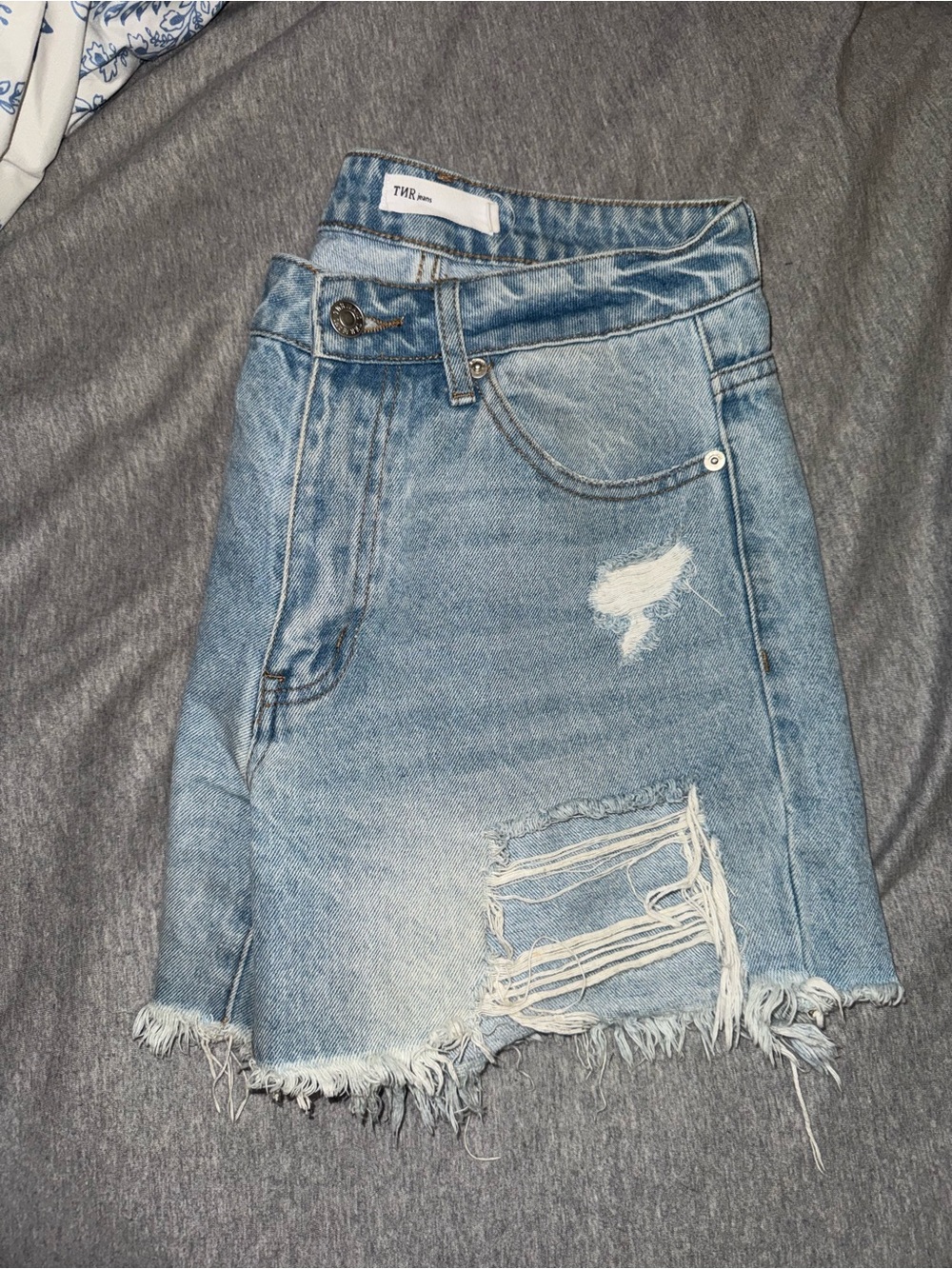 Denim Distressed Mini Skirt in Light Blue